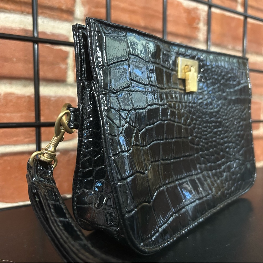 Sondra Roberts black snake pattern wristlet